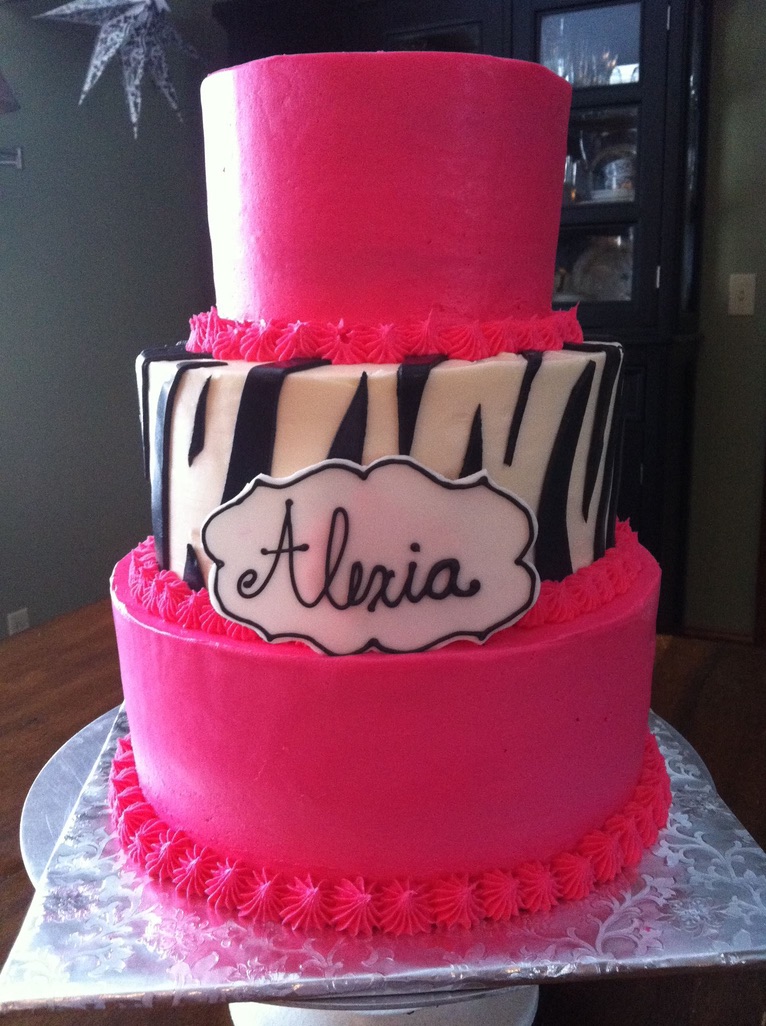 Three-tier hot pink cake with a zebra-stripe middle tier and name plaque