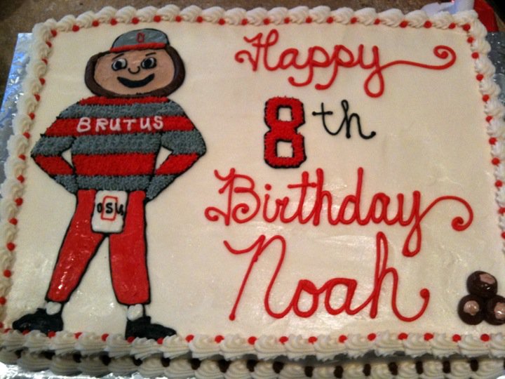 Sheet cake with a piped Brutus Buckeye mascot and red script lettering